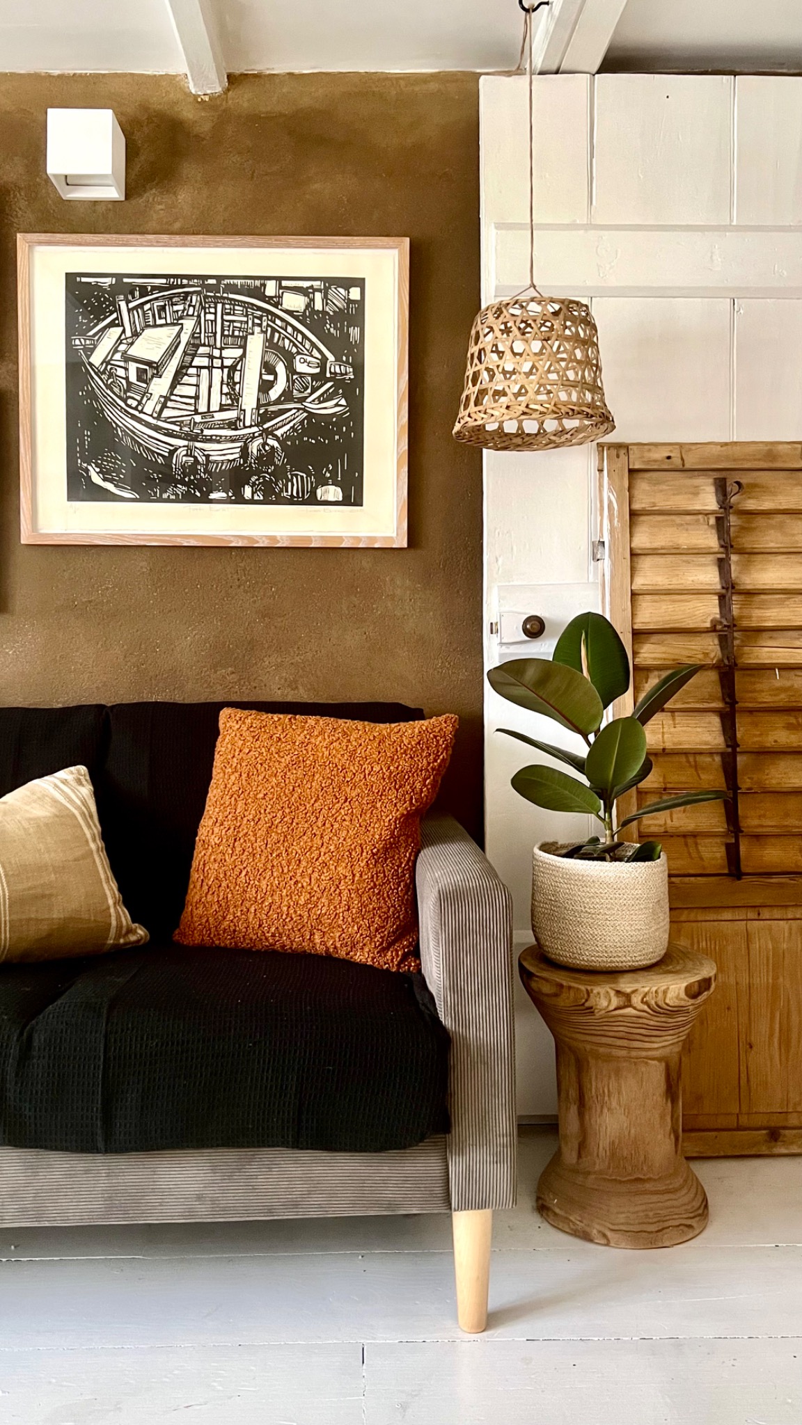 A considered corner of Dunroamin with natural timber, woven textures and warm ochre accents