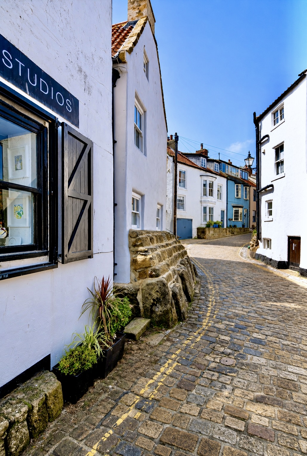 A narrow cobbled lane through the old village in Staithes